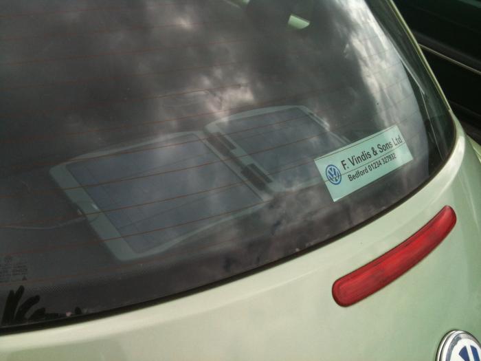 Small solar panel on the rear window of a VW Beetle