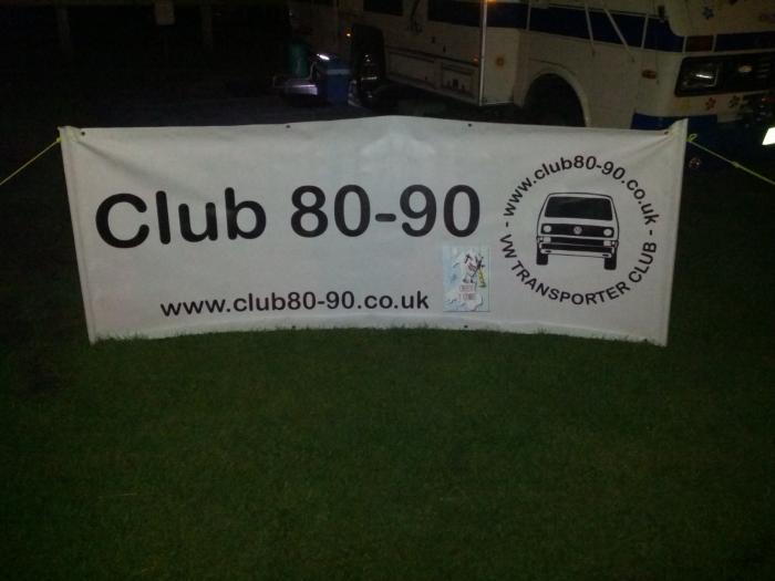 Club 80-90 VW Transporter club banner at a campsite