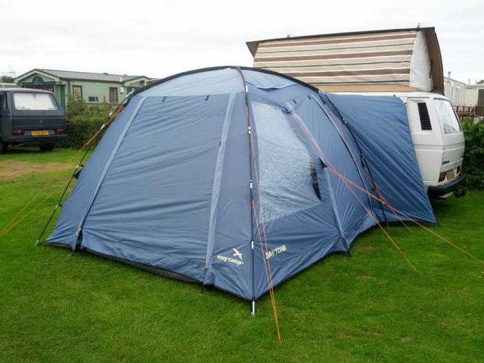 Tent pitched next to the T25 campervan