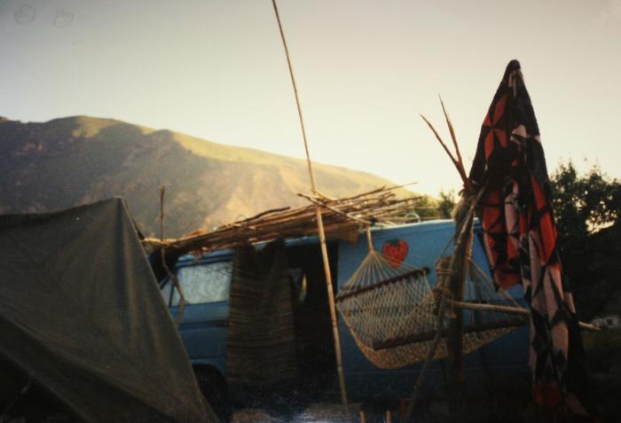 Hammock and shelter rigged up beside the van at dusk