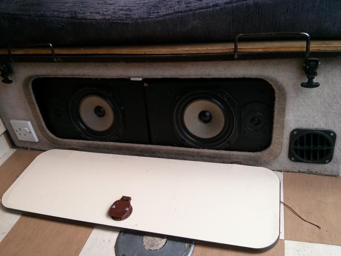 Speakers and a fold-down table inside the T25