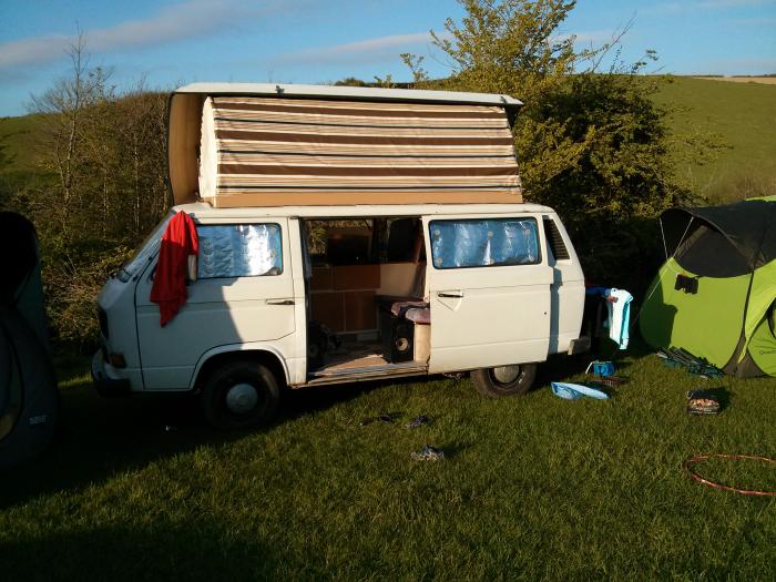 T25 set up at a campsite with a small tent beside it