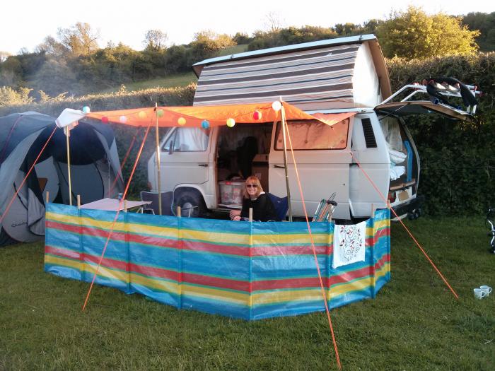 T25 with an orange canopy and a striped windbreak