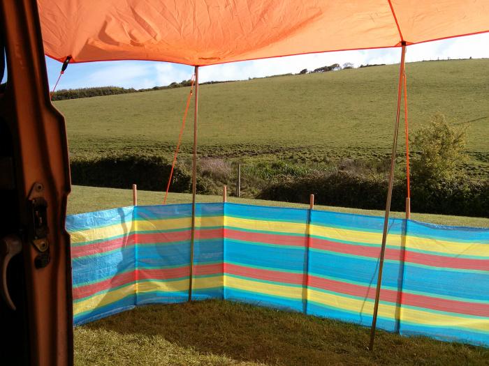 View from inside the camp past the striped windbreak