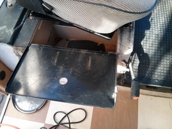 Seat swivel base stops the battery/ under seat compartment door from opening and closing