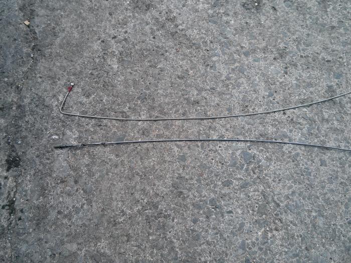Two lengths of dipstick wire laid on the ground