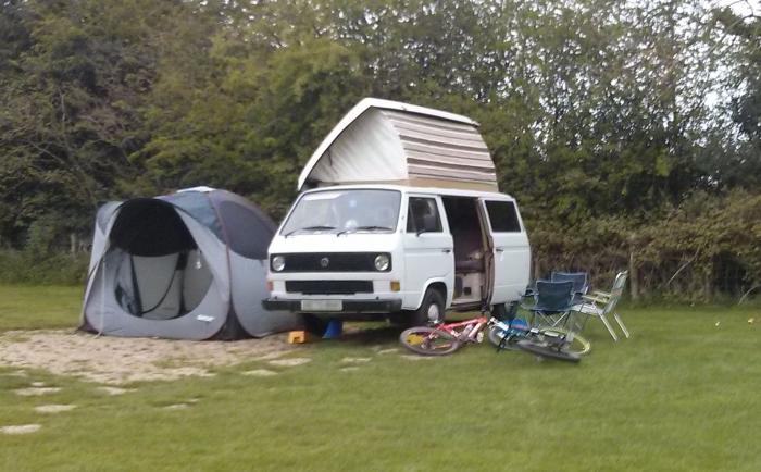 Rocky camping in the Forest of Dean with a pop-up tent