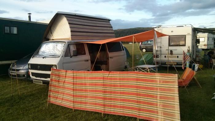 Rocky with an orange canopy and a striped windbreak at Wychwood festival