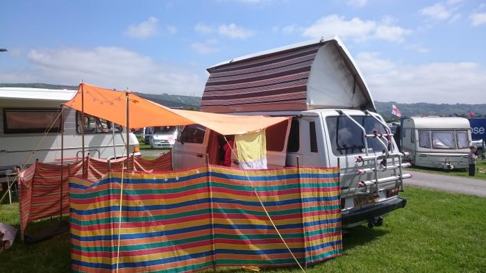 Rocky set up with a canopy and a windbreak at Wychwood festival