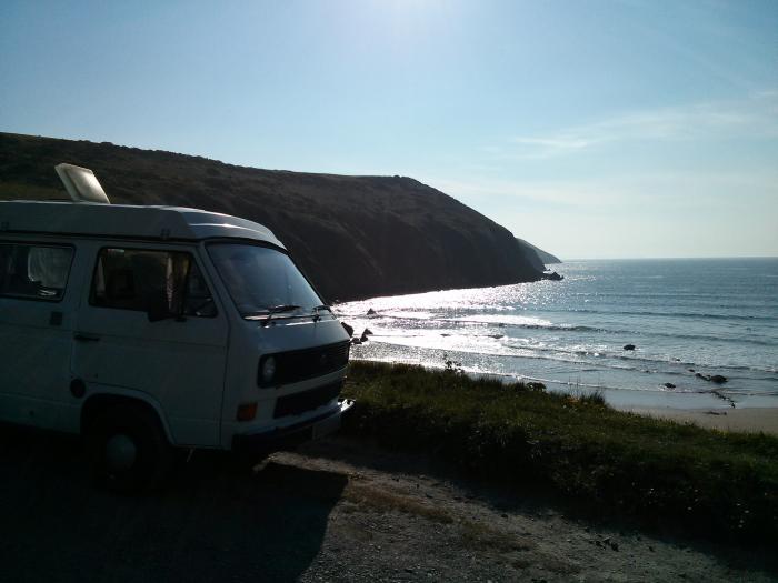 Rocky the VW T25 parked up looking over Putsborough Sands