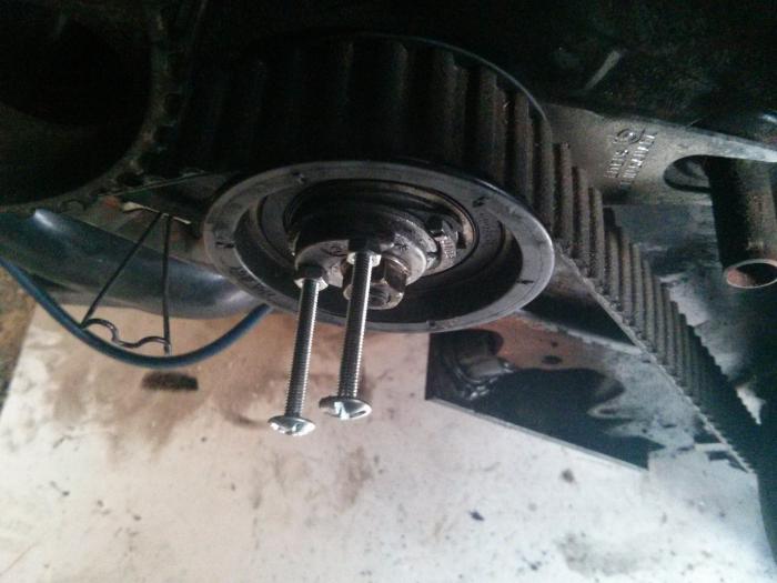 using bolts to help with timing belt tensioner