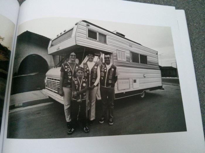 photo of family stood by their camper
