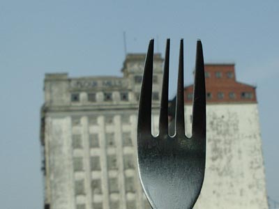 fork in front of derelict flour mill